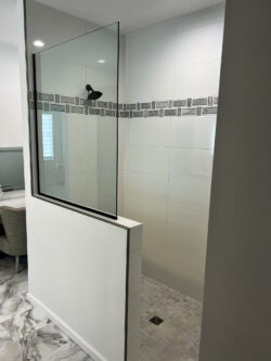 Primary bathroom remodel with large vanity, built-in storage tower, and LED mirror by Sablotny Floors