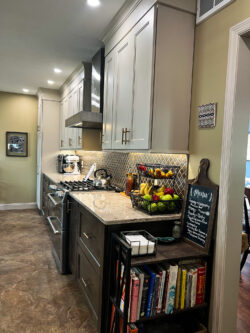 Kitchen remodel with white shaker cabinets and tile backsplash by Sablotny Floors in Jacksonville IL
