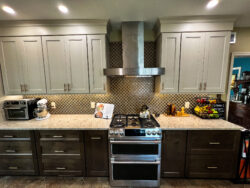 Open-concept kitchen remodel featuring island seating and hardwood flooring by Sablotny Floors