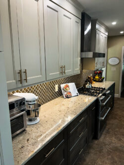 White shaker kitchen cabinetry and marble countertops installed by Sablotny Floors in Jacksonville IL